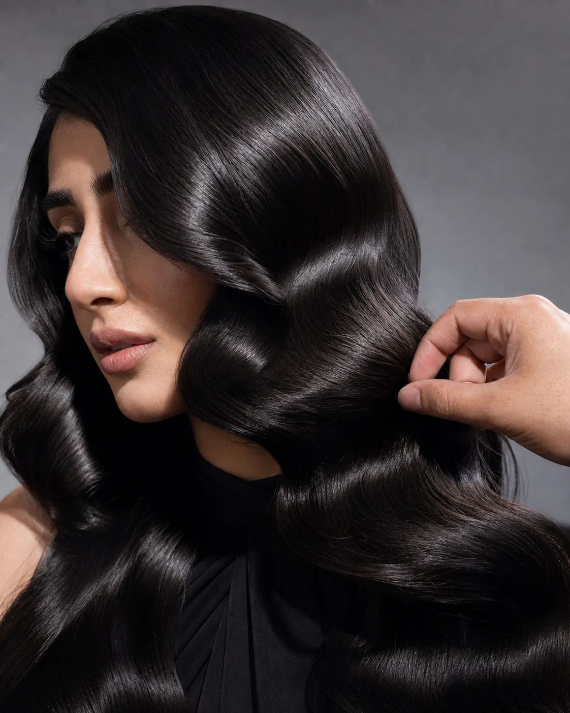Close view of glossy sculpted dark hair