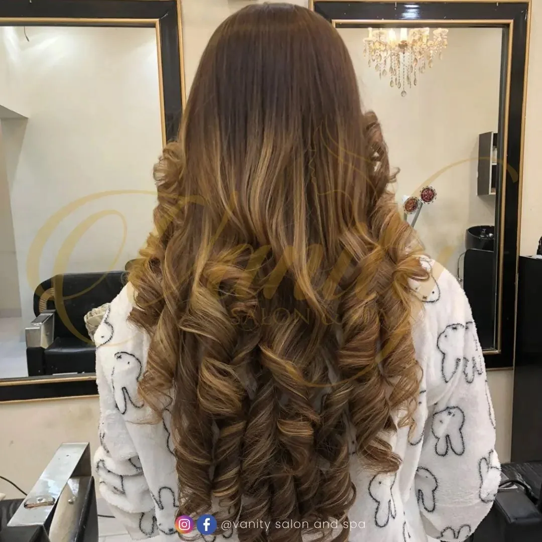 Dimensional warm hair colour finished at Vanity Salon